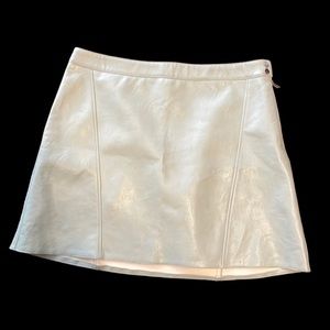 NWT mint green faux leather skirt with side zipper and buttons.